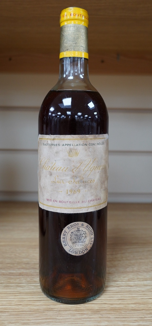 A bottle of Chateau d'Yquem, 1969. Condition - fair, level just above mid shoulder, label poor